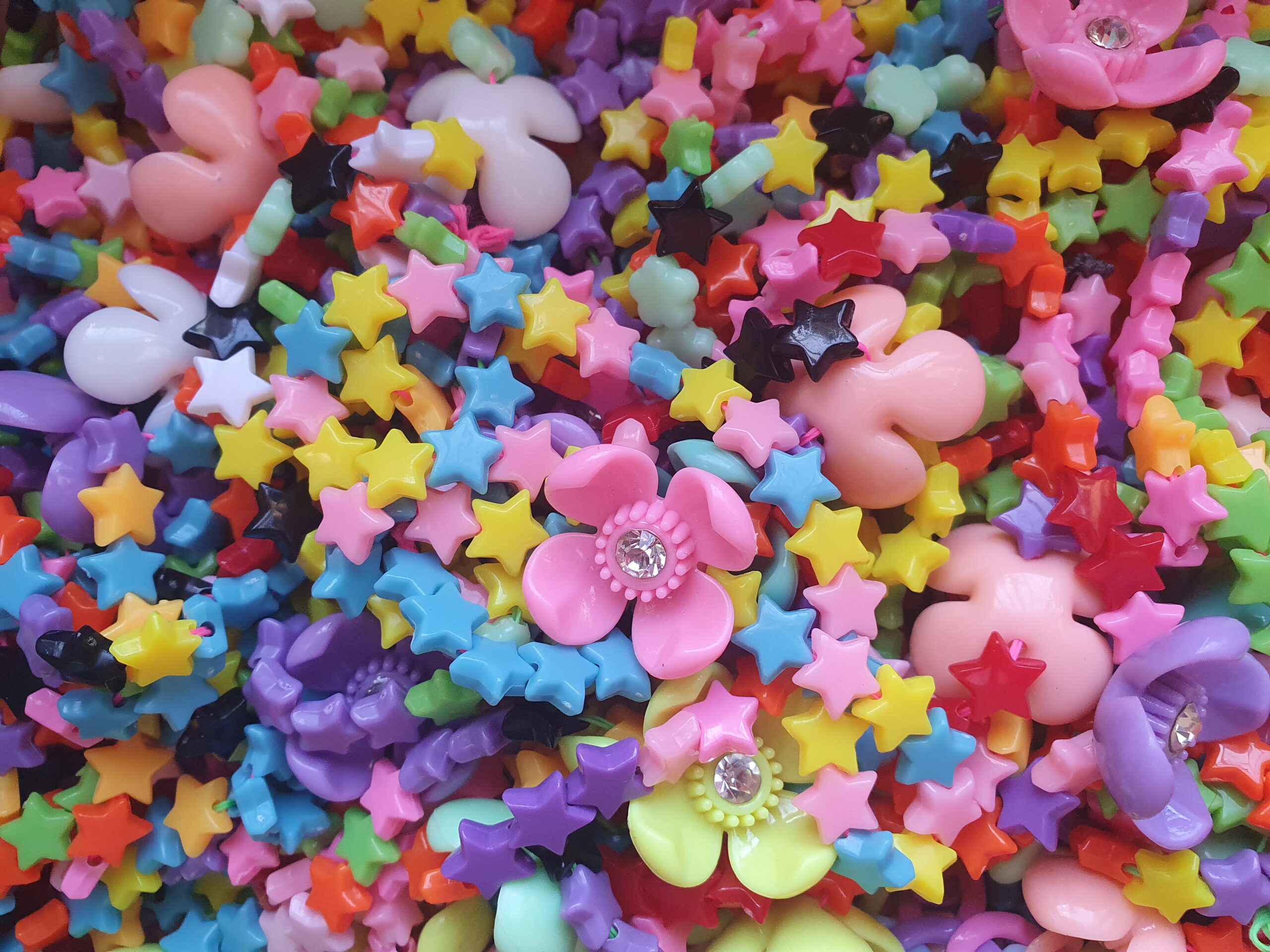 A box full of second hand star shaped plastic beads may seem daunting to many people… but to two neurodiverse people, this sort of hyper-focussed task is exactly what we need to quiet the mind in January 2024.