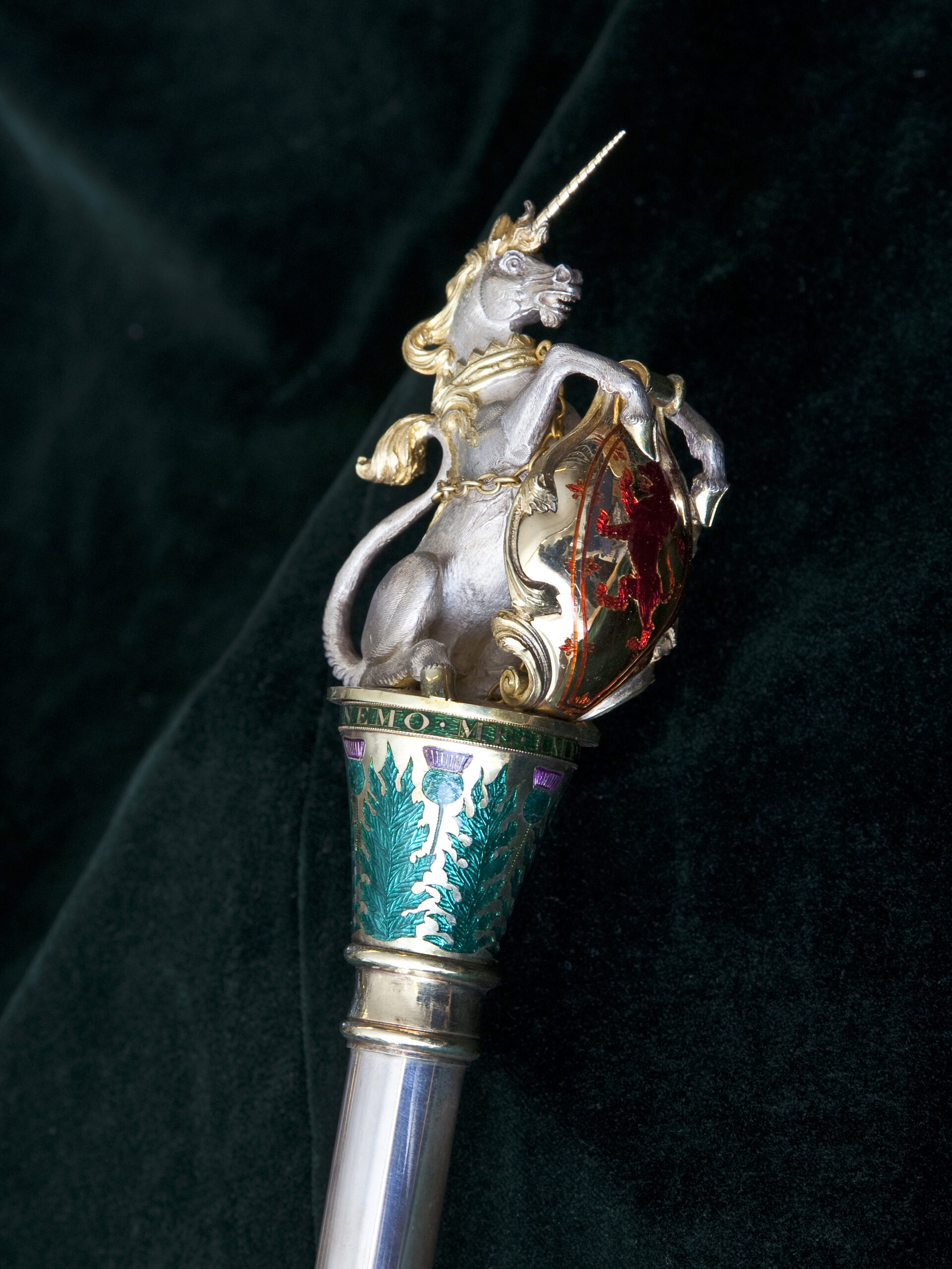 A regal silver unicorn features atop the 19th century ceremonial rod or wand, part of the regalia of the Usher of the White Rod reproduced by Permission of the Trustees and Factor and Commissioner of the Walker Trust.  Photography by National Museums Scotland