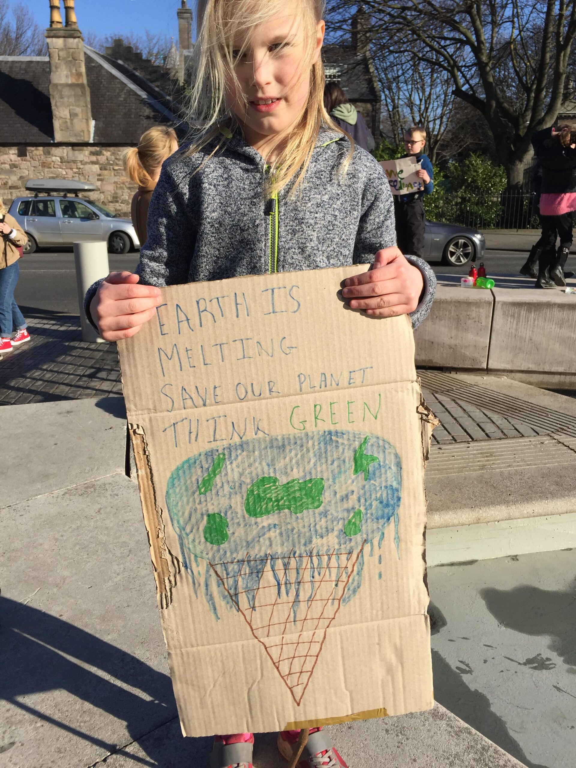 Bridget aged 8, outside the Scottish Parliament for the School Strike for Climate protest in 2019 . Image courtesy of Bridget's family