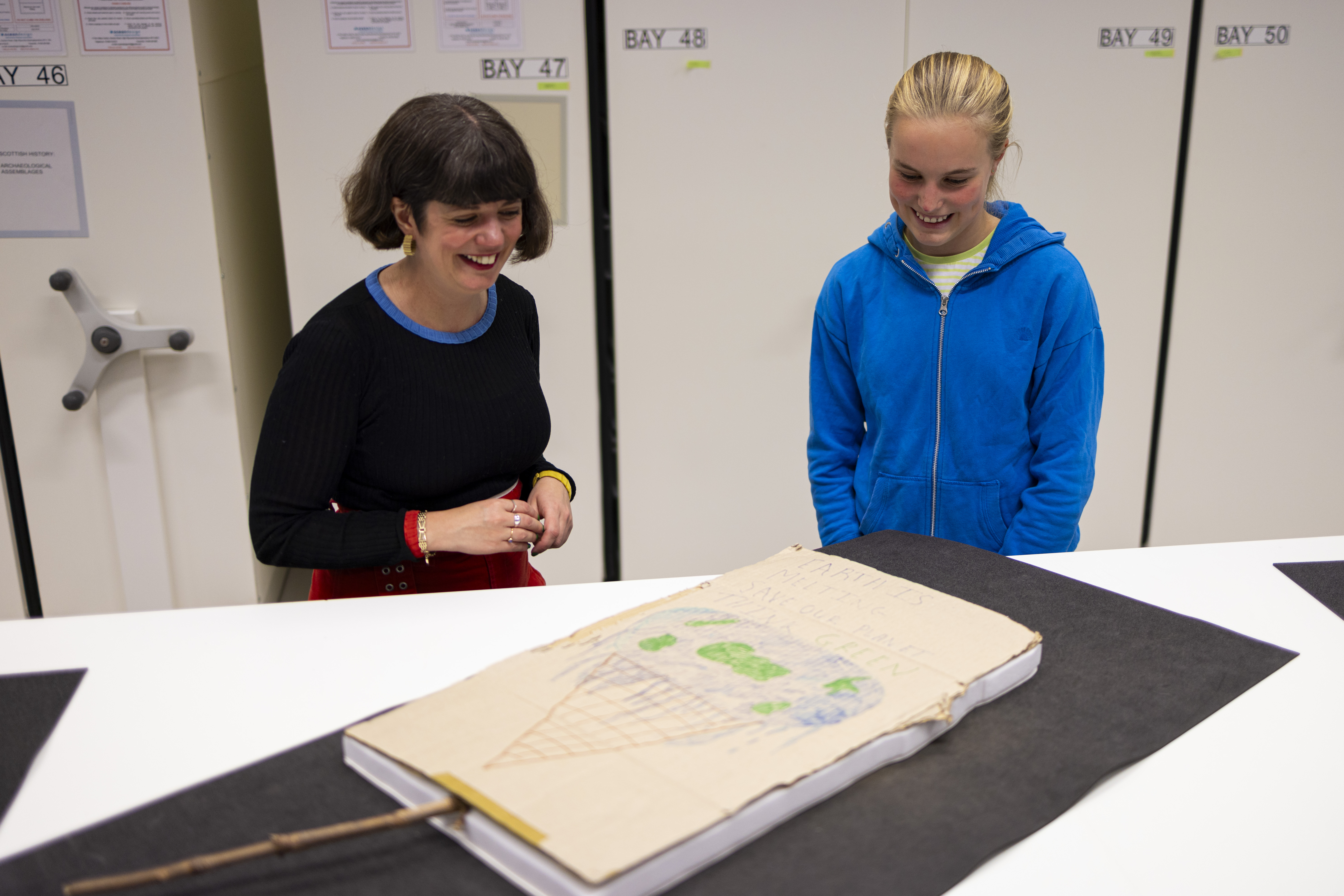 Bridget tells Curator Mhairi Maxwell about her climate protest placard at the National Museums Colletions Centre. Photo (c) Duncan McGlynn (4)