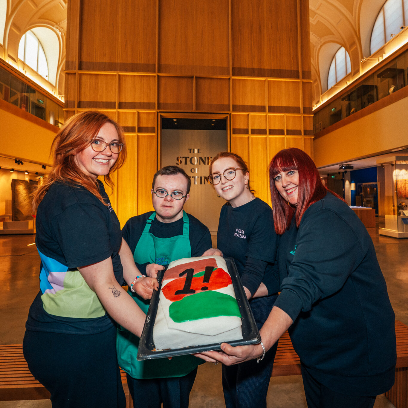 Perth-Museum-and-Stone-Cafe-staff-pose-with-1st-Birthday-Cake.-Lauren-Andrew-Kali-and-Laura-left-to-right-Photo-by-Bart-Masiukiewicz-aspect-ratio-350-350